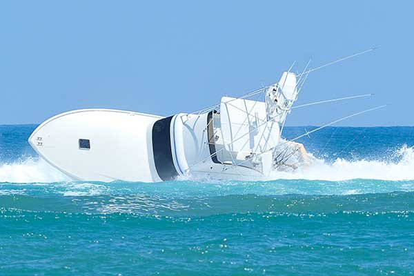 breaking-wave-rolls-large-boat.jpg