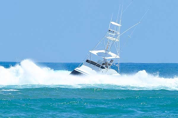 breaking-wave-swamps-large-boat.jpg