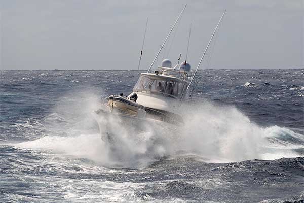 enclosed-fishing-boat-breaking-waves.jpg